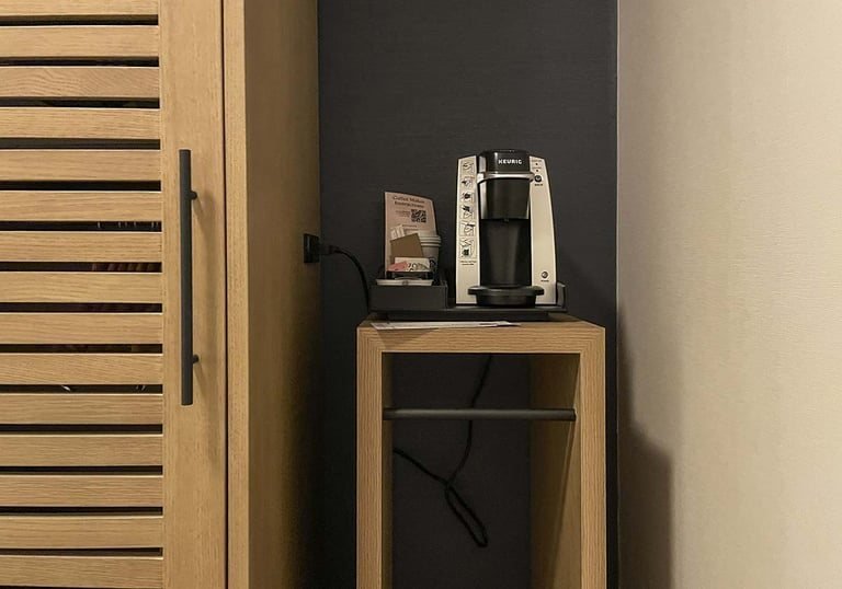 Guestroom minibar cabinet shown by Anhe Furniture